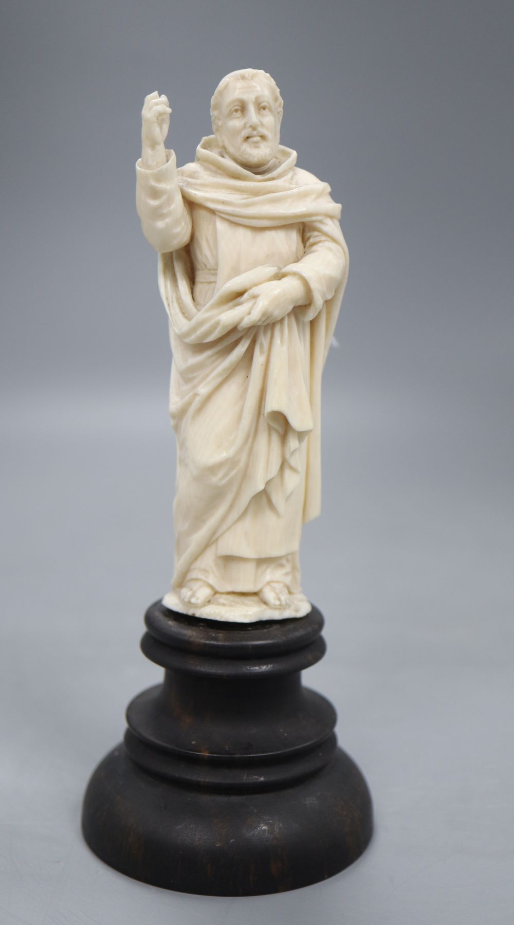 An ivory depiction of the Pope on wooden base, height 17cm